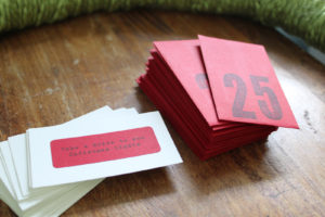 Family activities written on paper with numbered envelopes